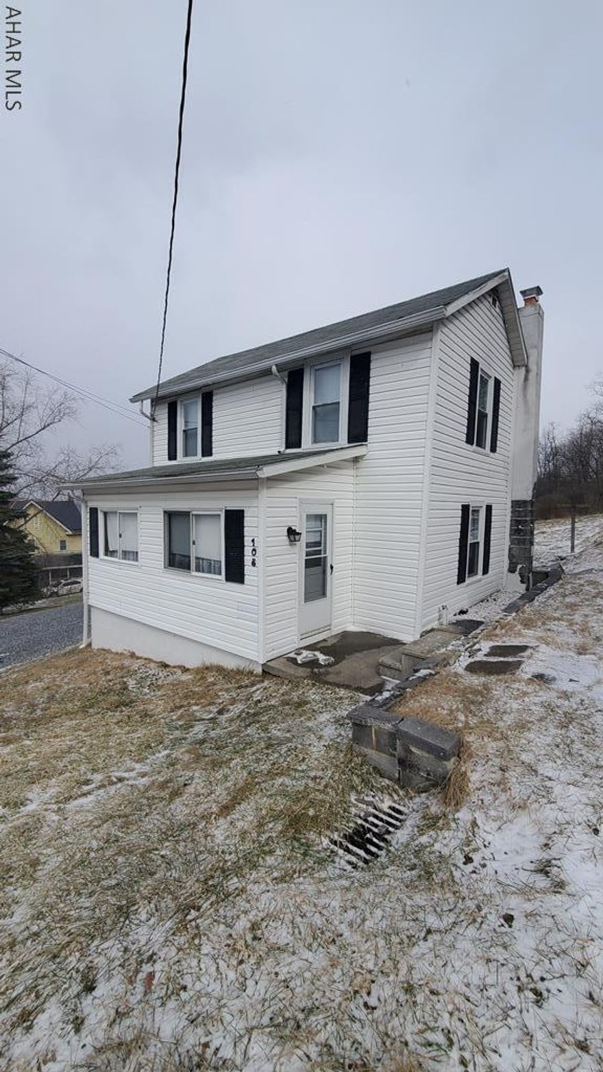 Starter home or investment property in a small town.  This 2 bedroom house needs some updating but has some potential.  Newer windows and vinyl siding. Nice enclosed front porch/bonus room that could be adjusted to be part of the main floor space. Do not follow GPS directions.