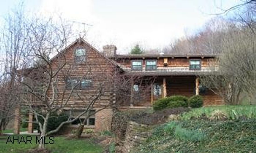 Mountain estate with 204.5 acres!  Impressive red pine log house with fantastic mountain views. Mountain estate with 204.5 acres! Impressive red pine log house with fantastic mountian views. 4BR/3 full baths. Country eat-in kitchen, dining room with views, rustic great room w/cathedral ceiling, beamscherry hardwood floors, master bedroom on first floor, loft. Basement level has family room, laundry, workshop, sauna, sunroom opens to patio. 3 covered porches. Outbuildings include barn and 2 fiberglass storage buildings. Acreave includes 35 acres open fields with 12 fenced acres, 170 wooded acres. Spring on property. Excellent hunting!