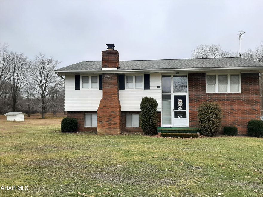 Welcome to your new home in the country! This three bedroom, two bath home sits on a quiet 3 acre parcel near Yellow Creek State Park. This home is well maintained with an updated, well equipped kitchen and dining area that opens to a covered deck. Large living room with plenty of natural light or relax in the lower level family room with a wood burning fireplace. Also on the lower level is the laundry room and 3/4 bath. For more convience, there is a one car integral garage plus a one car detached garage. There is also a large shed/workshop on the property. This home is equipped with an easy to plug in generator. This one is priced to sell and won't last long! Call for your tour today!