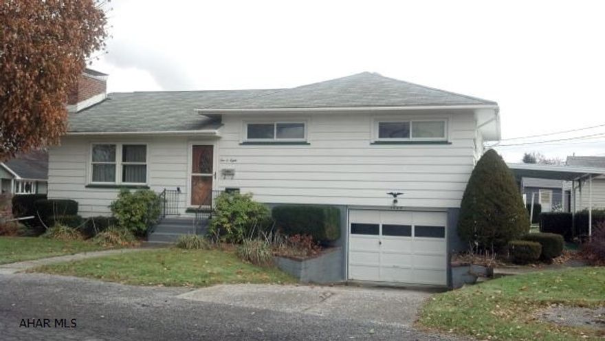 Terrific Opportunity! Lovely, a bit outdated-but well maintained 3BR, 2BA Split Level within walking distance of Hollidaysburg Jr. High. Hardwood floors, updated windows, so many possibilities with lower level areas-easy care corner lot. Really must see-at this price, won't last long!