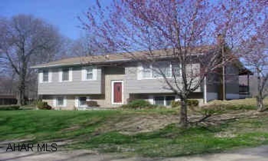 Large covered deck and private backyard.