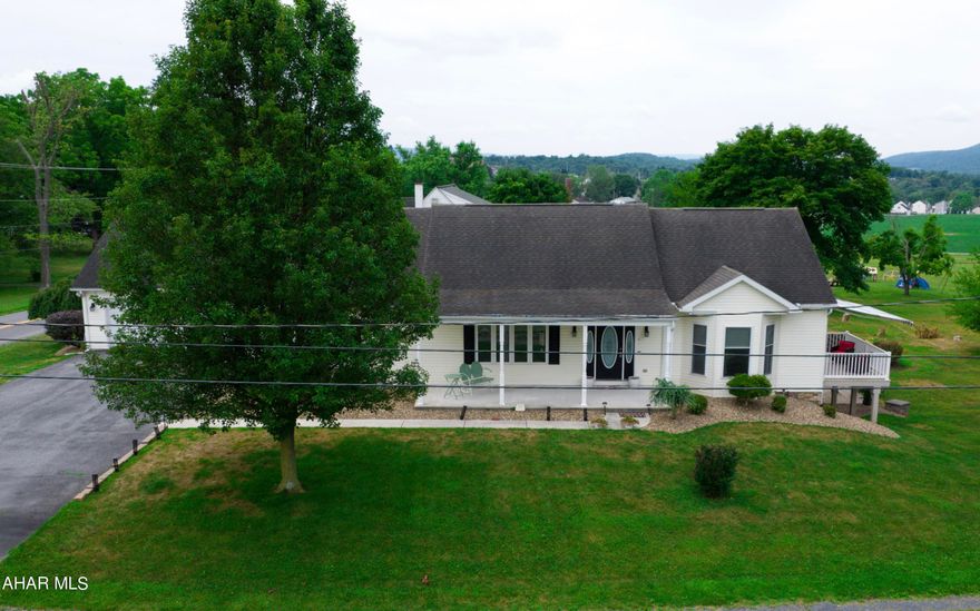 Imagine relaxing on a covered front porch while enjoying gorgeous views in this absolutely beautiful renovated home.  The home's many large windows and spacious decor will beckon you to stay.

The large and inviting living room is found off the central foyer through French doors.  Large windows take in stunning views while French doors lead out to a private porch with new retractable awnings.  The addition of a cozy gas fireplace just enhances the fabulous space.  

Also included on this side of the house  are a guest room and home office which share their own 4 piece bathroom.  The lovely upgrades are obvious and extremely welcoming.  One can easily see how this home would awe its guest and homeowners.

The spacious dining room also enjoys plenty of natural light and an amazing view.  Interior and exterior spaces blend easily as it opens onto the spacious kitchen with tons of natural light and incredible work surfaces with ample storage.  French doors lead out to another wonderful outdoor living space with its huge deck with new retractable awnings.  A fenced yard is  found off this deck for pet lovers to entertain their furry friends. 

Found off the kitchen is the entrance to the huge oversized garage and also the laundry room with direct access the the owners suite.  All rooms on the first floor have custom window treatments.  New floors, new painted surfaces and light fixtures add to the appeal of this upgraded home.

The owners suite has its own unique charm and wonderful updates.  You can just imagine lying in bed with a cup of coffee and enjoying the sunlight as it awakens the senses with such a wonderful view.  A huge bathroom and wow.. the walk in closet.... This owners suite is really special.

Did we mention the lower level..... its an entire living space with a spacious bedroom, living room, dining room, kitchen and  bathroom with two person jacuzzi tub.    Walk out entrance to another  covered deck which makes another  private living space or a great recreational room.  

The home has so many updates but one must mention its new heating and air conditioning system which lends itself to amazing energy efficiency.  Also, the home has the comfort and warmth found in radiant floor heat.  It's a terrific feature of this home.

If additional bedrooms are required, the home will not disappoint because there is another unfinished second floor that would provide an unbelievable amount of space.  Don't miss the second floor, it will surprise you.

There are so many features of this home that make this home special, please don't delay as this will not last long.