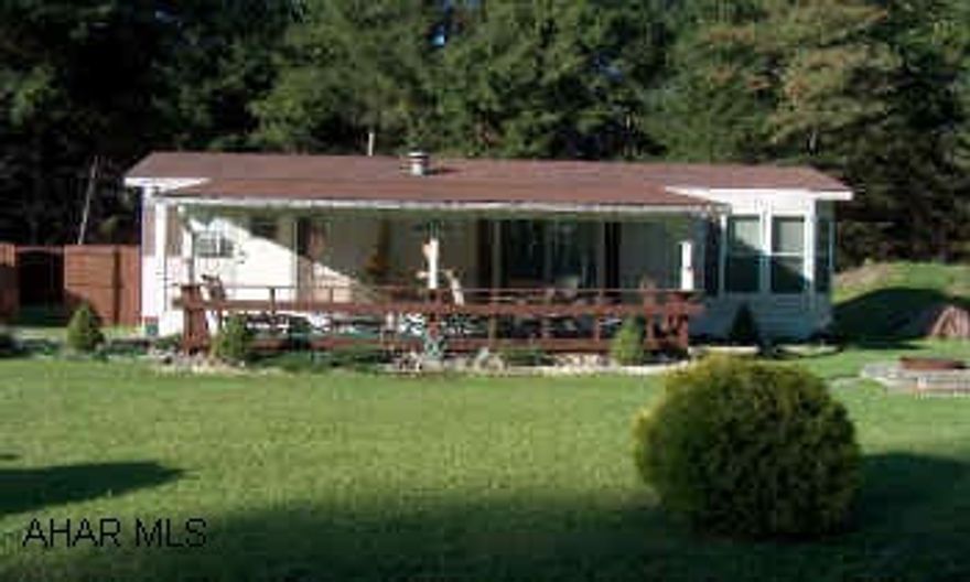 Super nice park model on large deeded lot in Glendale Yearound. Includes large shed with garage door- possible workshop or bunk room. Also includes refrigerator, range, microwave, surround sound system & window treatments. Brand new mattress & box springs.  The large deeded lot includes full grown evergreens.  Must see!