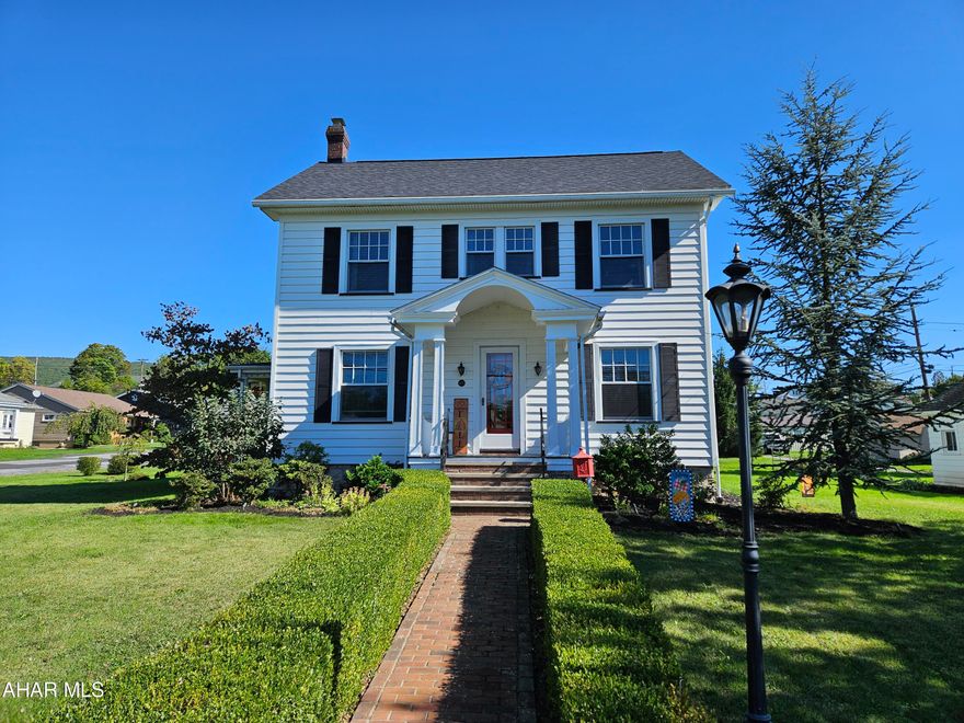 Discover country living in Altoona with this stunning 3-bedroom home on nearly half an acre! This remodeled gem blends historic charm with the convenience of a wonderful location!  Original woodwork and updated hardwood flooring are only two of the inviting features. The charming front yard features a bush lined, brick sidewalk leading to an antique iron mailbox and to a welcoming covered, bench lined stoop. Inside the delightful entryway, a spacious foyer opens to an oversized living area with industrial-style lighting and a brick gas fireplace. The formal dining room boasts exquisite hardwood floors and a chic new light fixture. The kitchen is equipped with upgraded stainless steel appliances and granite countertops. Upstairs, you'll find spacious bedrooms with great closet space and a beautifully custom-tiled bathroom featuring a linen closet and stunning stained glass window. The finished third floor offers ample storage and so many possibilities for flex space! Outdoors, enjoy professionally landscaped gardens - both flower and vegetable!  A gravel firepit perfect for fall gatherings, and an oversized, turret-style covered deck, ideal for entertaining or relaxing with a good book. What more could you ask for?