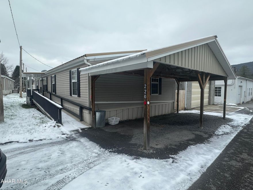 Updated and close to everything is what you will find with this conveniently located double wide in the Greenwood area of Altoona! Spacious Updated eat-in kitchen with plenty of cabinet space, Both a living room and family room, primary bedroom with a large spacious bath and a walk in closet. Two additional bedrooms and an additional bath in this spacious home. New metal roof in 2019. Covered carport for parking. Ramp into home. Lot rent $385/month includes water/sewer & lawn maintenance.