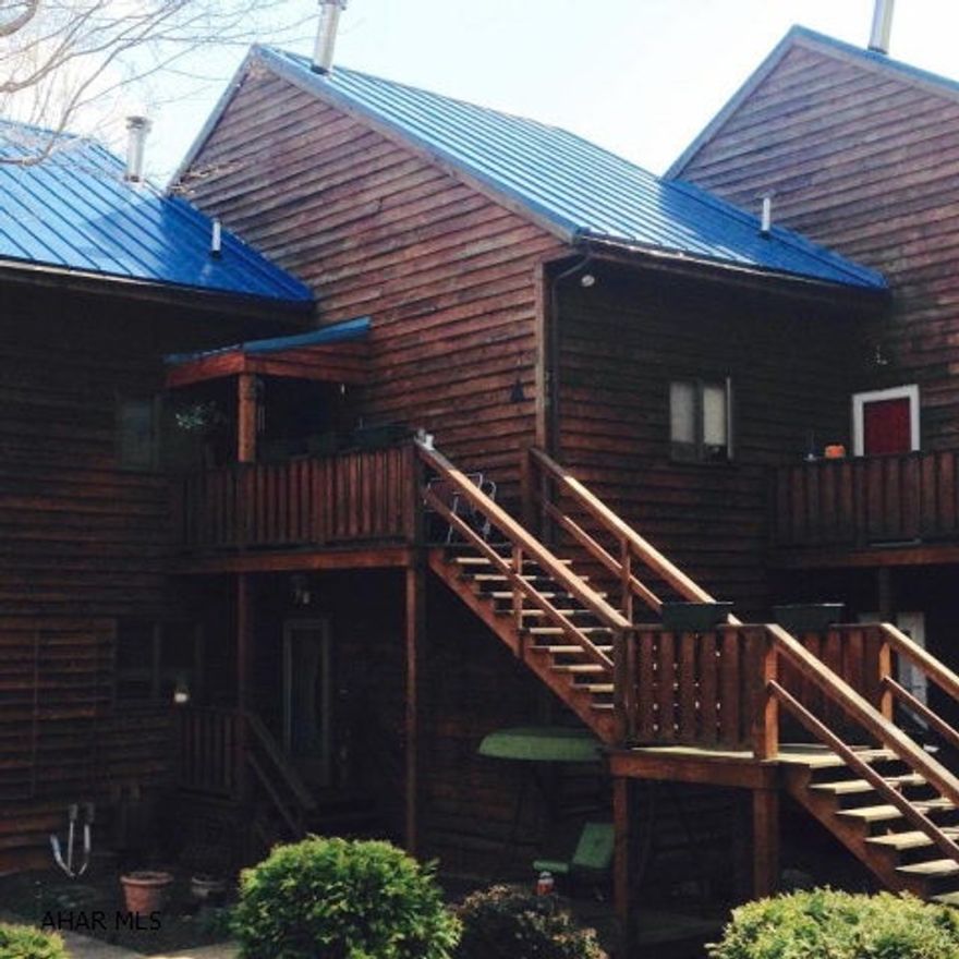 High end Cedar Condo close to Blue Know State Park. Easy living. Second floor unit with lots of extras including Corian countertops, stone tile, jetted tub, carport, propane fireplace, and all appliances.  2 BR, 1.5 BA with spiral staircase that leads to large loft. HOA fee of $250/month that includes outside maintenance, lighting, trash removal, snow removal for road, shared water and shared septic. Ready for easy living? This one is for you. Quiet, peaceful setting that is sure to please.