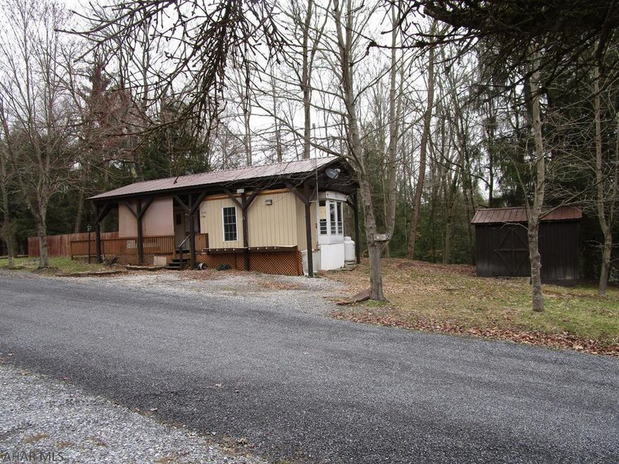 Spacious lot with lots of frontage.  Large Breckenridge unit with closed in porch that has laundry hook-ups.  Shed.  Camper needs some work.  Lots of potential with your initiative.   Located in Glendale Yearound.