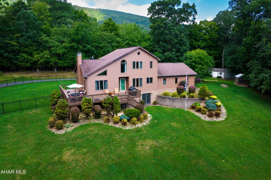 $20K Reduction!  Excellent location on a beautiful & private countryside setting; only 2.5+- mi. to Bedford Borough, the Omni Springs Resort, & Elks Country Club & golf courses.  2-STORY, great room w/ FP & T & G wood ceiling. QUALITY-UPDATES in kitchen: new granite countertops, c. tile backsplash, flooring, cab. hardware, & deluxe range/air-fry oven.  WOW-FACTOR, basement family rm.. w/ FP, exercise area & 1/2 bath. Oversized, sealed & heated garage.  Powder-coated fencing; undergd. pet fence. Greenhouse; yoga bldg.; stg. shed. Paved drive.  Sq. ft.  gross living area & taxes to be confirmed by buyer.  The 2,768+- SF above-grade includes basement area per tax assess. file.  Shared, Broncos Rd. - private maintenance.  Propane tanks leased from Ameri-Gas. DISCLOSURE TO BUYERS: There are active recording/audio, ring, sec.systems. Attractive, 2-story contemporary home design.