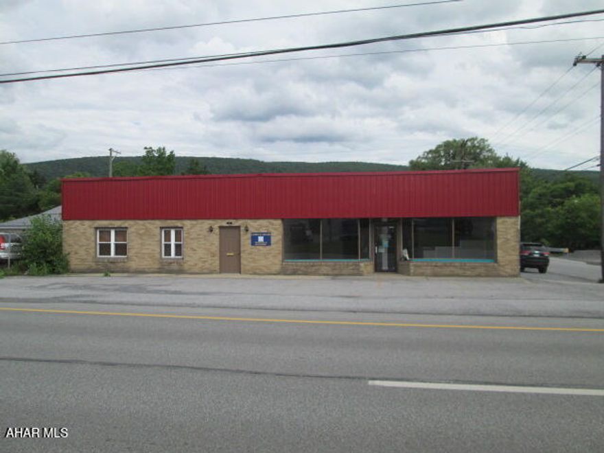 Great multipurpose building with many different possibilities containing just under 6,000 square feet.  Currently a law office in part of the building that is interested in staying if new owner wants.  Other side of the front of the building was most recently a beauty salon; rear of the building also has some finished area and storage/warehouse areas.  Building has also been utilized for retail in the past.  Parking in front and side of the building.  Lots of space for the money.