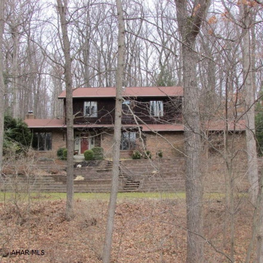 Elegant home in Briarwood. 4 Bedrooms, 2.5 baths on one acre. New 2008 kitchen w/granite eat-in island; bar area; 2 wall ovens; pull-out trays; great lighting - above cabs & below; recessed; pantry; desk area; ceramic tile. Kitchen open to familiy room w/gas fireplace on brick wall & great forest view out large window. New Master Bath with silestone vanity top, ceramic tile shower & floor, beautiful large mirror & bronze fixtures. Main bath has large silestone two-bowl vanity & matching linen closet plus built-in cabinet all in aged finish; sunken deep tub w/silestone surround & pewter fixtures. New carpet in bedrooms. Two heat pumps for 1st & 2nd levels. Gun room/basement w/safe & built in cabinet. Private Setting. Massive retaining walls & back yard area features three-season perennials.