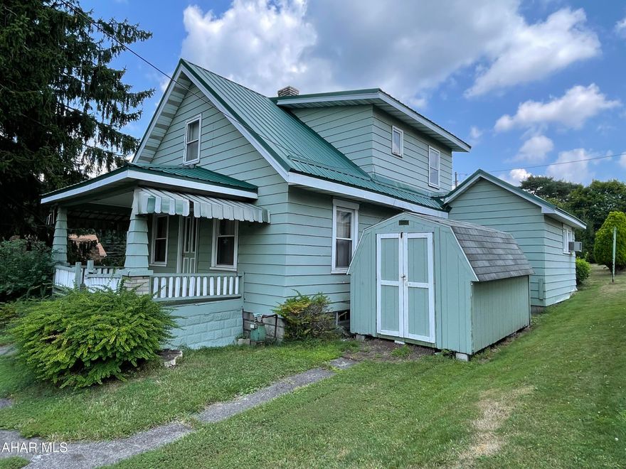 This starter is ready for a personal touch!  The roof was replaced in 2016, and due to a leak in the second floor bath, bath was remodeled along with drywall, electrical and carpet was all replaced in rooms below the leak. Sewer line was also recently made compliant. First floor has a kitchen, dining, large living room, bonus room featuring a fireplace and a first floor master bedroom with full bath. Upstairs you will find 3 bedrooms and a full bath. Plenty of off street parking.
