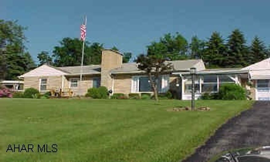 47 year old, stone rancher with in ground pool, attached garage and barn.  take road from Patton towards Carrolltown, go .5 from Patton, home is on right just before driving range.