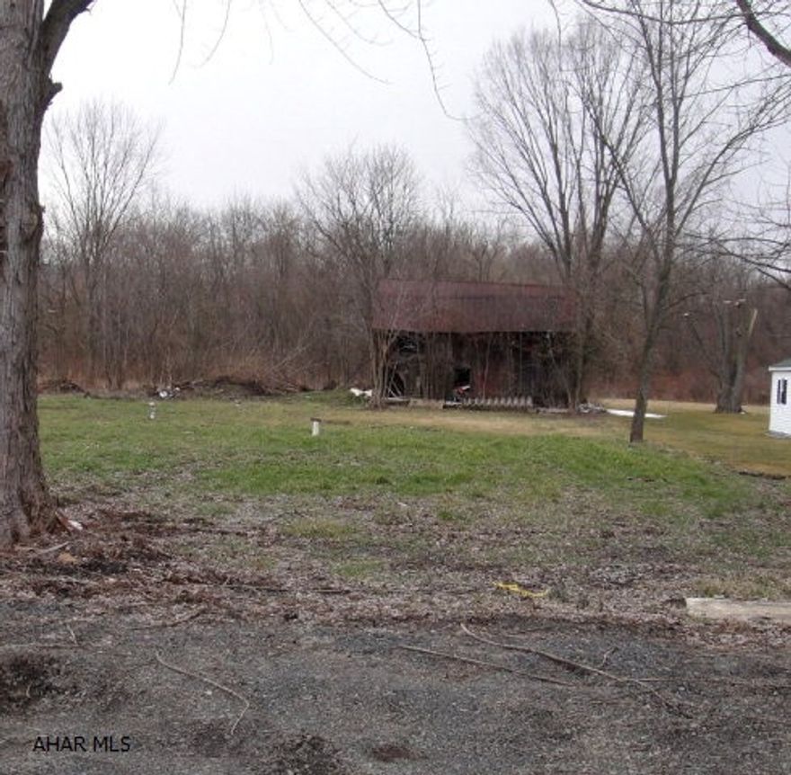 Very nice building site complete w/ 2 wells and public sewer. Outbuilding on the property. 0.567 acre.