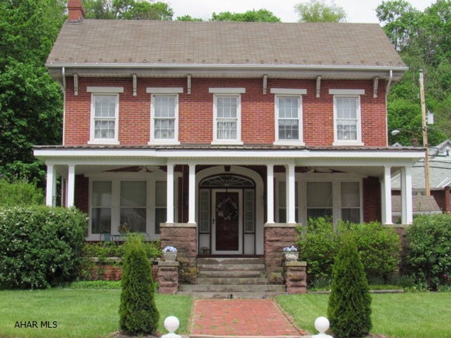 Seller Says Price it to Sell!This unique 4BR,4BA,4 Fireplace brick home with its newly added welcoming Amish built porch  & its 2 car detached garage is priced to sell.This home has many possibilities: a single family home, bed & breakfast, or combination single family/business by using the back area of the main level currently being used as an office with a full bath and laundry area, could be turned into a Hair Salon, Retail Business, or other income producing endeavor. The lower level of the home could be rented as an apartment with its own separate entrance equipped with kitchen, living room, bedroom and full bath. Amenities: Original hardwood floors, crown moldings,arched doorways,bay windows, builtin bookcases etc.. Close proximity to I99 between Altoona, State College, & Huntingdon