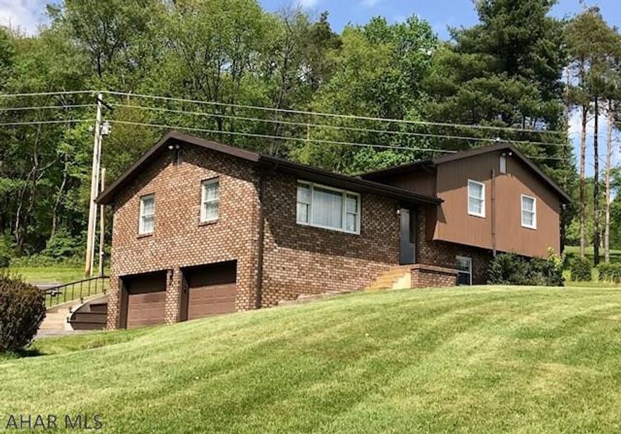 So, you want acreage and privacy and a great price? THIS IS IT!!!  Very private, beautiful and tranquil setting on 33 AC. This  bi level has 3 Bedrooms, 2 1/2 Baths. The kitchen has cherry cabinetry with an abundance of counter space. The Living Room and Dining Room JUST had carpet installed. There is a huge 23 x 18 Family Room with fireplace. There is 4 acres of grass in front of the house and the rest is surrounded by woods. A metal Pole Barn has a great workshop and lots of storage- you can do alot with this newer barn! An added feature is the beautiful Chest Creek which runs through the edge of property. Don't wait too long on this one - it's not going to last! Acreage, privacy, woods and a 3 bdrm house with a newer barn at a great price - Qualified buyers only!