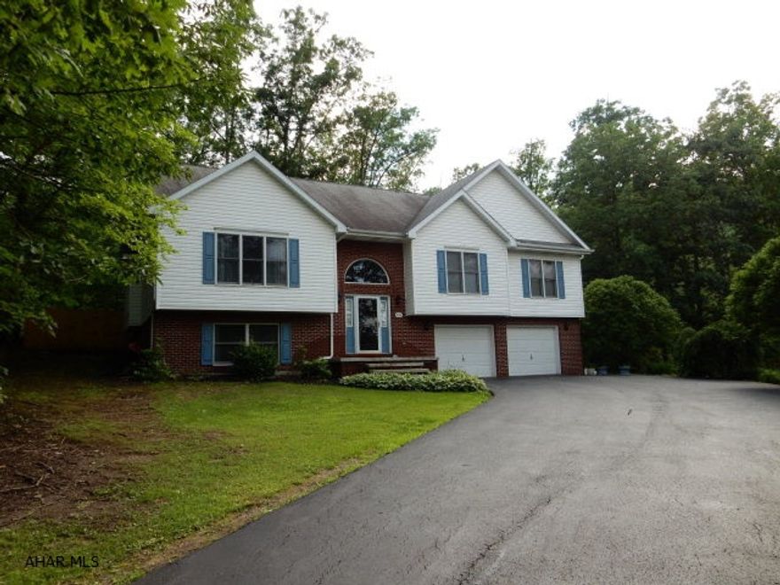 This is not your typical bi-level home.  Custom built by original owners, with very open floor plan and spacious rooms through out the entire house.  Vaulted ceilings give the feel and look grandeur.  A large, level wooded lot has a fenced area for children or pets.  There are also double decks  to the rear of the house and one is separate off the master bedroom.  You will love cooking in this large kitchen which enables an eat in area and a pantry, with lots of storage.  A large family room gives opportunity for just about anything.  This is a great feel home, inside and out!