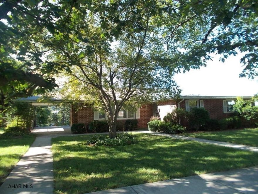 Brick home in the Borough! 4 bedrooms, 2.5 baths. Huge lot, 2 car integral garage heated, 12x41. Relaxing side porch, hardwood floors, large basement with brick fireplace. Needs work.