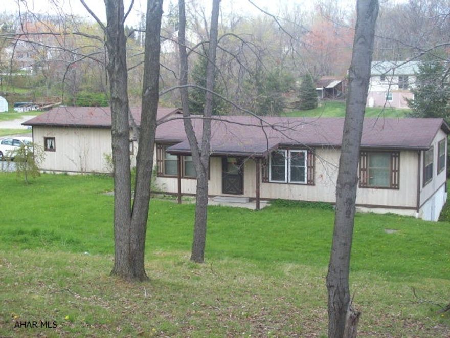 Great location on dead-end street.  Large flat lot.  Home is in nice condition with covered patio.  Economical budget amount for electric is $225 year round.  Oversized one-car garage.  Will qualify for FHA financing. Short Sale has been approved by bank.