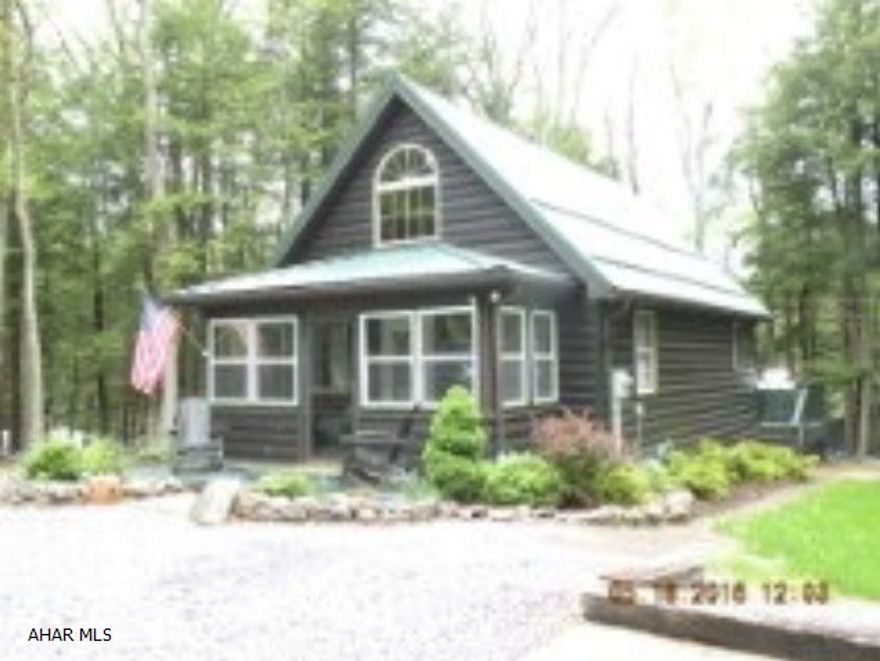 Cute cottage- 2 Br, 1 bath in immaculate condition! Beautiful Tongue & groove cathedral ceiling. Great FR. Also includes a 3 car garage. Located in GYR with all amenities; heated swimming pool, volleyball court, tennis court, horse pits & more. Minutes from State Game Lands & Prince Gallitzin State Park