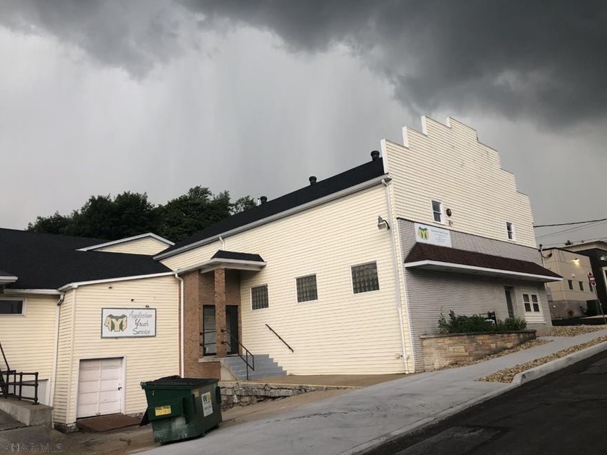 Great investment property with multiple rental space opportunities or use yourself and lease part of it out.  Parking available.  Sidewalks completed.  Great visability!