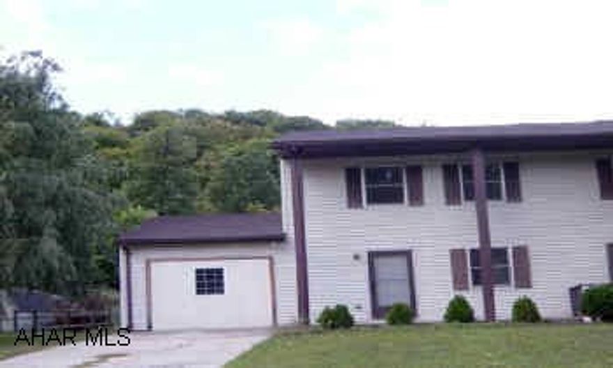 Main level family room, large eat in kitchen. Laundry in kitchen. Needs TLC.