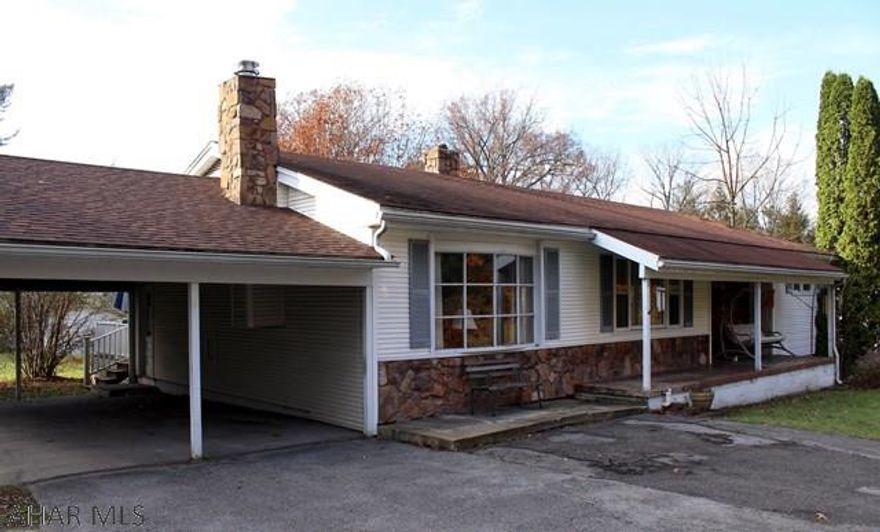 Charming ranch style home on a large lot!  This 3 bedroom 1 full bath home is nestled in a quiet neighborhood.  Open concept kitchen with included appliances and adjacent dining room.  There is access to a rear deck from the dining area with a nice view of the over half acre yard!  Family room features large windows and a wood burning furnace.  Spacious basement with plenty of possibilities! Double carport as well!