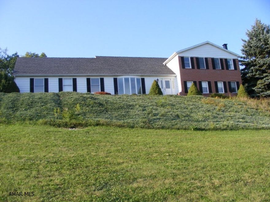 Spectacular views from this multi-level home on 23 acres with total privacy. Pretty cherry kitchen and large Master Suite.  A car buffs dream garage ...a 40x80 detached garage with heated floors and a 2nd story...parking for an RV!!!  Home could easily be a 5 bedroom . Homes does need some TLC...