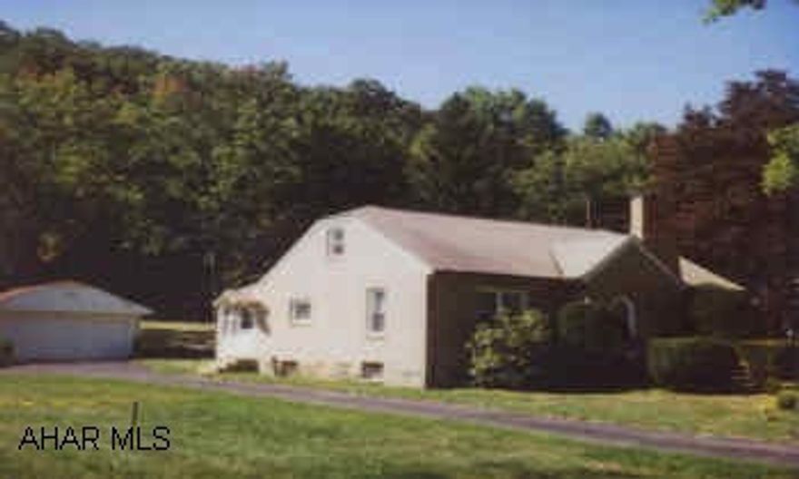 ATTRACTIVE 1AND A HALF STORY ON MORE THAN 1/2ACRE. 3BEDROOMS, FIREPLACE, LARGE GARAGE, PUBLIC SEWER BEING INSTALLED NOW. ABOVE GROUND POOL.