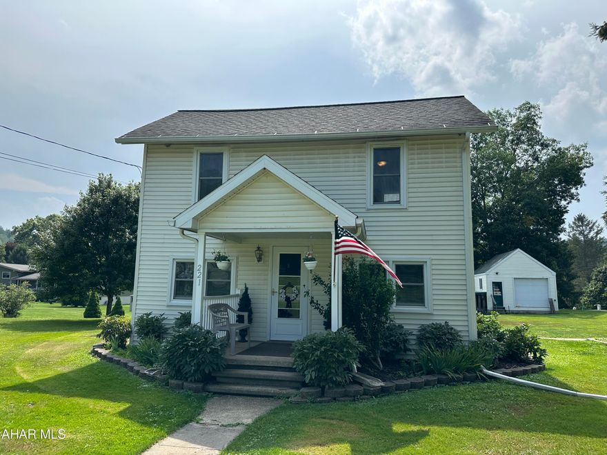 Beautiful landscaped two story home with patio, sundeck and fire ring.  Plenty of space for entertaining.   Large two car detached garage, workshop and greenhouse.  Includes an extra lot with public water and sewer.  The total acreage is .6141 which includes the extra lot.