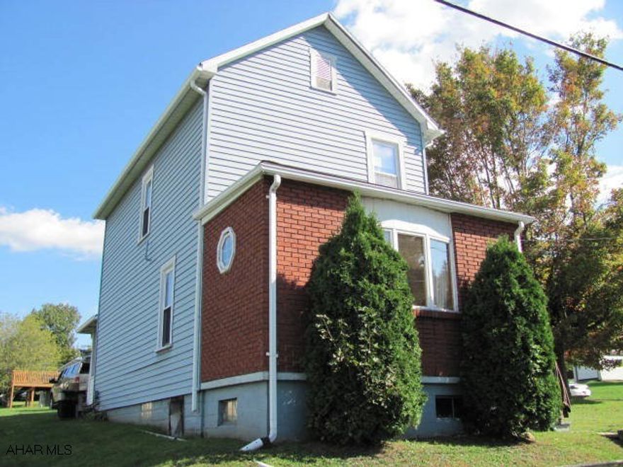 2 story, 2 BR, 1 & 3/4 bath home located on large corner lot. 2 car detached garage. Priced to sell