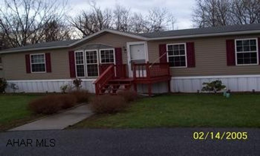 Immaculate sectional home, 3BR, 2BA, living room, family room, and sunroom, 2 gas fireplaces, shed, covered deck. Lot rent $350.00