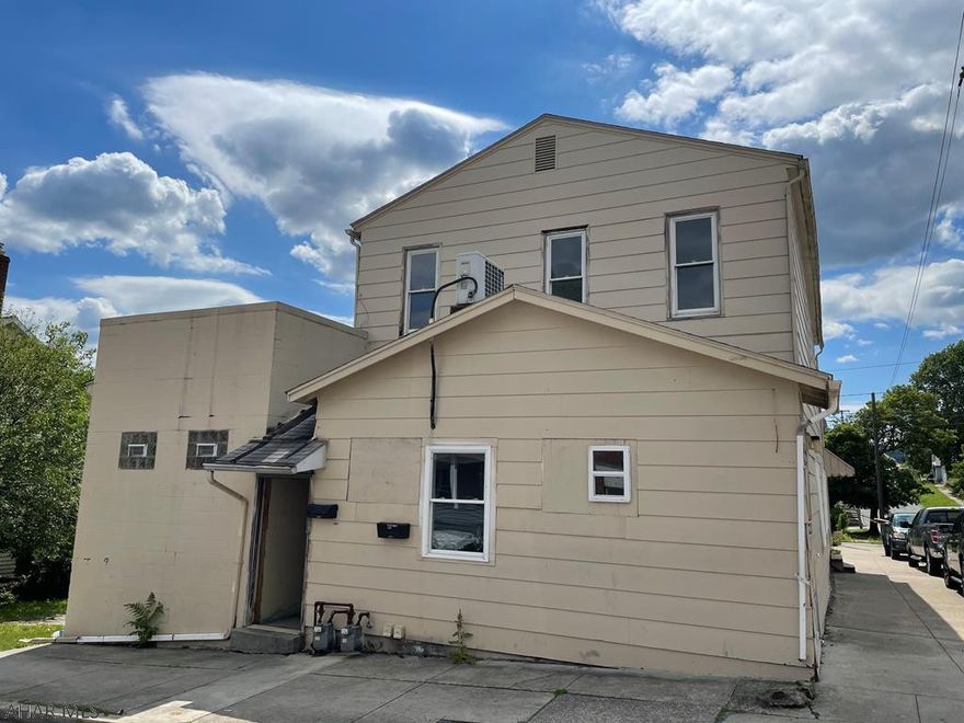 Previously this property was a neighborhood bar, but it has been converted to 2 units. The first floor has 4 bedrooms and 2.5 baths. It also features a large open concept living, dining, and kitchen area. The second floor has 3 bedrooms and 2 baths. All utilities are separate for each unit. This property sits on a large corner lot with lots of off-street parking. Section 8 approved. There is a large basement for storage. There are 4 parcels included. 37x70, 25x37, 25x37, and 38x120. Great opportunity to live in one unit and rent the other.