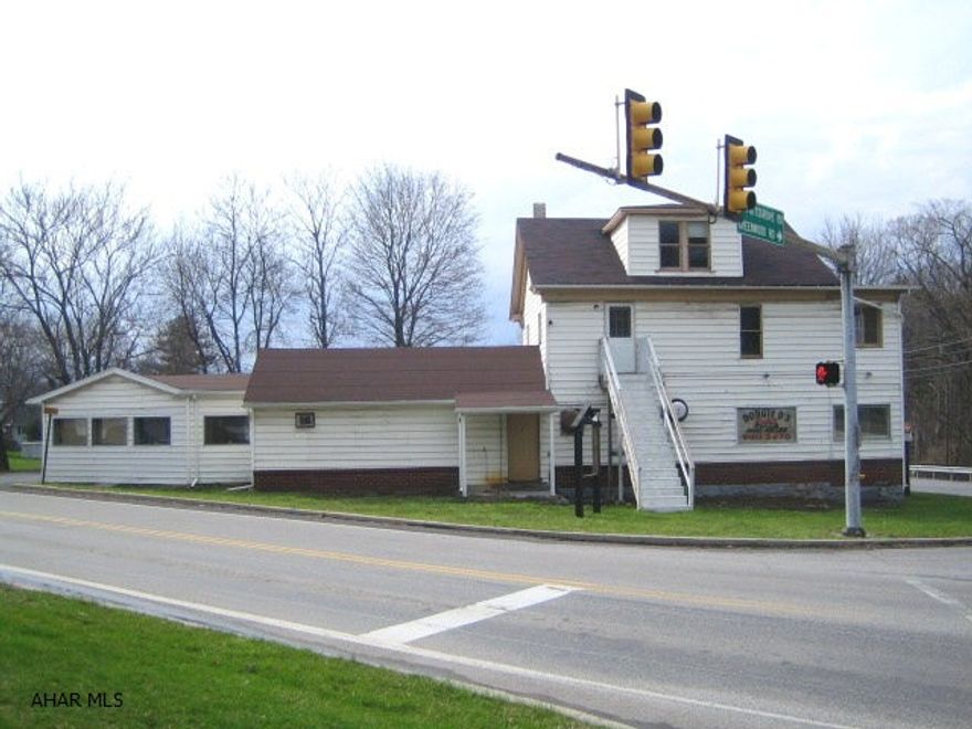 PRIME COMMERCIAL OPPORTUNITY! High visibility, corner location at busy intersection of 764 and Greenwood Rd. Former pizzeria, but many other possibilities. Work in remodeled space downstairs, live in nice apartment upstairs. Ample parking.