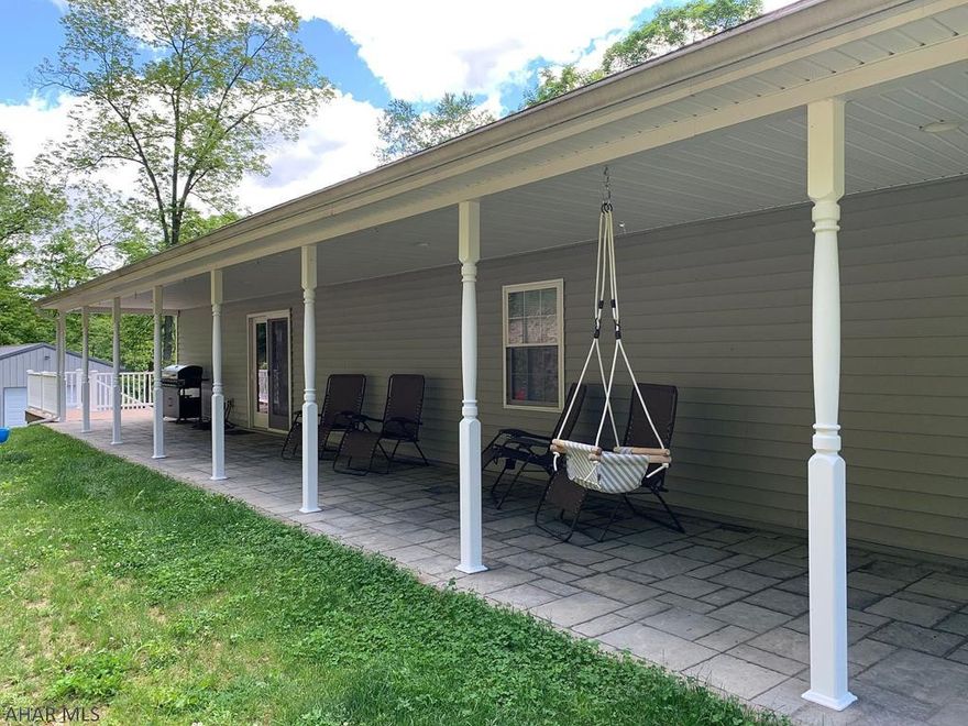 This raised ranch home is new from top to bottom.  Newer roof, siding, windows, baths, kitchen, floors, patio, driveway, this list goes on & on.  Truly a move in ready house on a private 5 acre lot. You will love the open floor plan on the main level.  The huge K/DR area is open to the FR.  The newly finished basement with a stamped concrete floor, knotty pine walls & a brand new bath and tons of space & could easily be an in law suite or one huge family play space.  The covered patio is a great place to relax and watch the deer pass by.  This home has an electric heat pump & a wood stove with a large supply of wood. Close to PSU Altoona!  Give us a call to take a look to see everything this home has to offer your family. List of improvements under other.