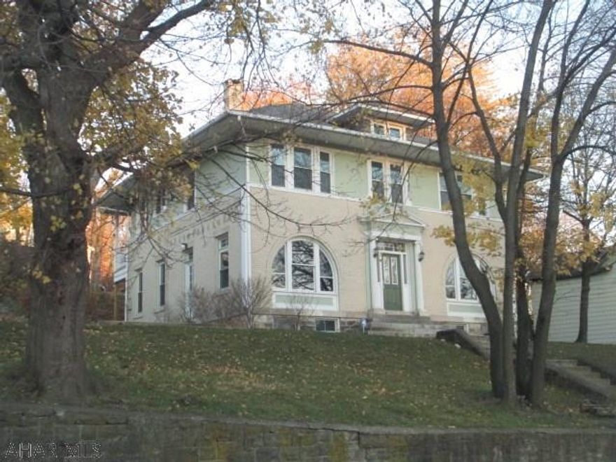 Classic Mansion features large rooms, hardwood floors, grand stair case, window seats, butler stair case, two antique fireplaces, wood columns, built in shelves, and on and on. Large lot provides plenty of parking and a cement patio for outdoor entertaining. Security system in place.  A beautiful combination of historic character, grand space, and modern function. There is no other house like this for the money. Come and see. Agent Owned.