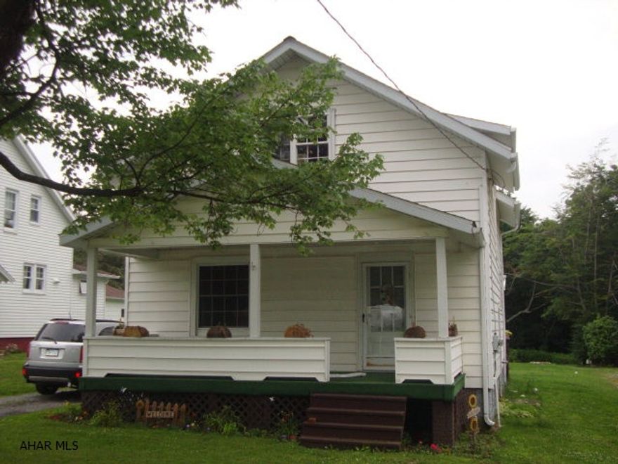 Here's a great starter home or house for someone wanting to downsize.  3 bedroom, 1 bath home has brand new oil furnace that is waiting for the upcoming winter to come to life.  Massive 2-story, 2-stall garage with electric garage door openers has plenty of storage space on 2nd floor and a 220 sub-panel to run all your tools and toys.  State game lands are directly to the left of the rear of this property.  Kitchen has been nicely updated and hardwood floors are in dining room and spacious living room.  All kitchen appliances stay, as well as W/D.  This is country living yet conveniently located in proximity to Ebensburg and I-99 in Bellwood.