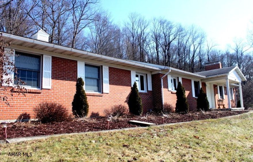 Sprawling brick ranch with countryside views on Imlertown Road in Bedford. Generously-sized rooms on the first floor with lots of closet space.  Oak kitchen with gas oven and range, dining room, living room w/ wood burning fireplace. Full finished basement with spacious family room, bar area, brick-faced, gas-fired fireplace and 3/4 bath.  Attached one car garage, paved driveway, and low maintenance upgrades including a heatpump w/ central AC.