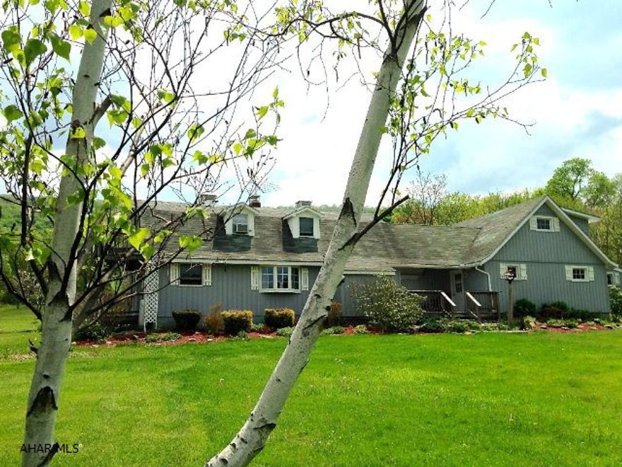 This beautifully renovated private retreat or home is a hunter's paradise. A huge stocked pond makes this home feel more like a lake front property. If you are seeking privacy and solitude than this property is for you! The home is surrounded by lush rolling hills and meadows. The large kitchen opens onto the dining room and living rooms. There is a main floor laundry room, bath and bedroom/den. Upstairs, a master suite lends itself to privacy with its double sinks, Jacuzzi tub and private deck overlooking the pond. A huge walk-in closet is found just off the master. There are 4 garages, two w/ rooms above that cold be made into add'l living space. One of a kind property! Add'l heat: energy efficient electric thermal storage.