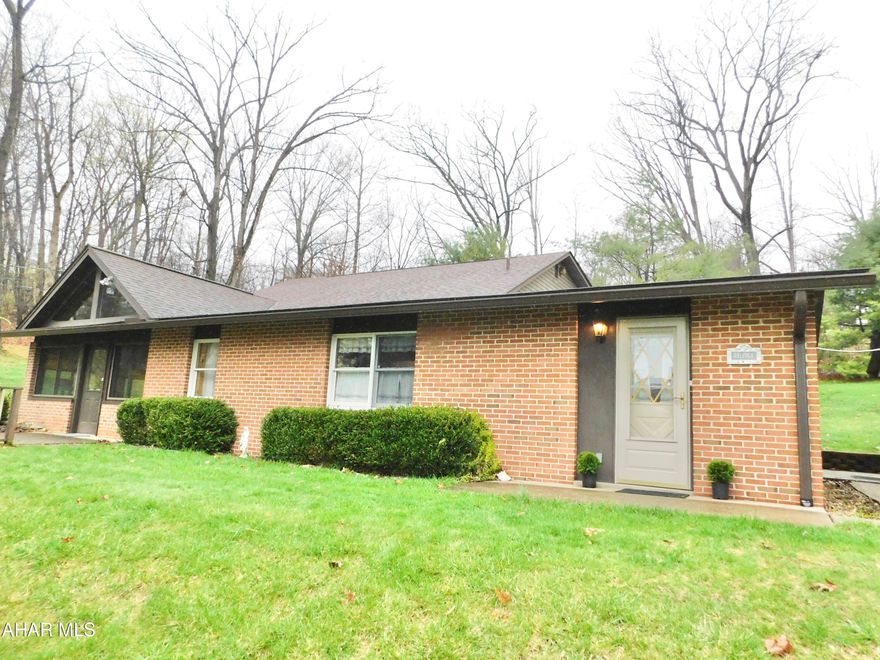 This home is so much larger that it looks! This 1 story home offers an additional 2-story addition with so much space. 2 Bedrooms on main level and bedroom on 2nd level could easily be converted to 2 large rooms plus tons of storage and a huge walk in closet. There are so many closets - no lack of storage. Updated kitchen and baths and meticulously kept inside & out. Don't miss the 3-season room with heat source to use year round if desired. There is an additional lot available to purchase if buyer has interest. Situated on a large lot with french drains and plenty of privacy from surrounding wooded areas. The Carport is wide enough for 3 cars.