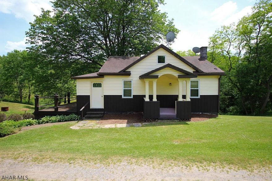 Unique design features, including a custom made arched light enclosures in living room and rounded walls in select upper level rooms, along with spacious outdoor living area highlight this charming 3 bedroom home about 1 mile north of the town of Madera. Over-sized single-stall garage with large workshop area and attached carport for additional covered parking. Great as a year-round residence or recreation getaway/camp. Home connected to public sewer. Less than 30 minutes to Prince Gallitzin State Park and State Game Lands nearby. Take a look today.