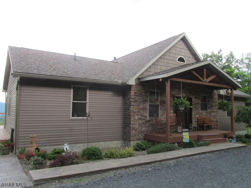 Gentleman's farm with a million dollar view!!  Gorgeous open concept home, stacked stone & vinyl exterior.  Great room w/cathedral ceiling, beautiful stone fireplace (propane), tile flooring "looks like hardwood", first floor laundry.  2 Full 1 half bath main floor, half on lower level (need shower installed).  Property is currently all electric - geothermal wells installed for radiant heat in floor - both levels.  Need pump system - heat pump for heat & air.  Stainless appliances, 2 barns, 2 pastures - see additional info - salt water pool