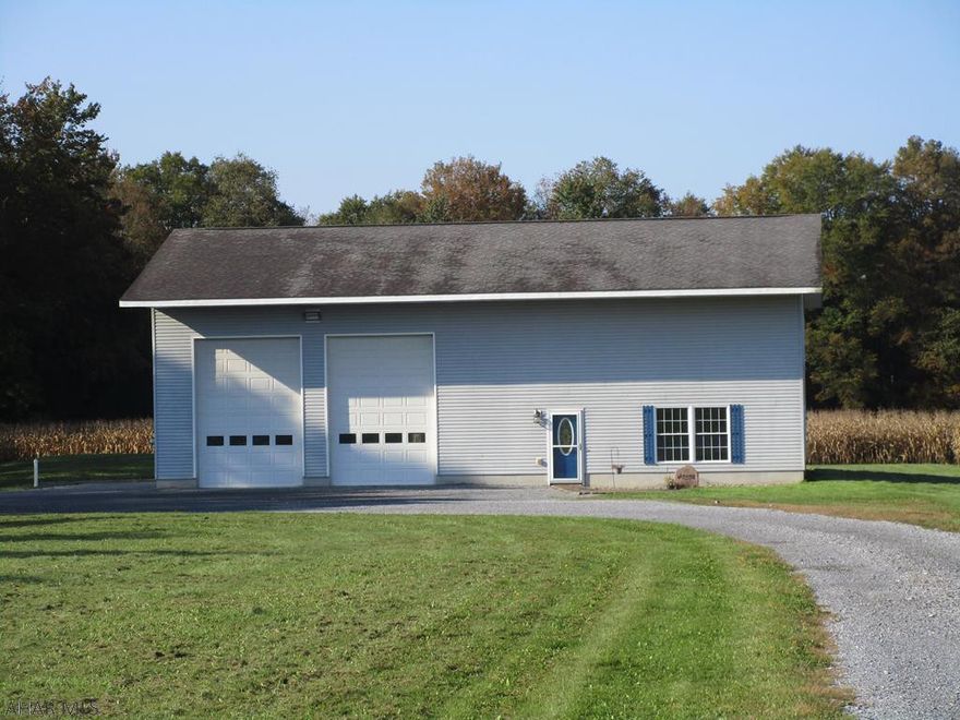 Great opportunity to own a home in the country! This unique home is situated on a flat 1.9 acre lot. Spacious rooms and an open floor plan offer many possibilities to make this home yours! First floor laundry/mudroom leads into the spacious 30 x 40 garage. The homes interior features first floor bathroom with separate shower and  soaking tub, a bright kitchen and dining area, first floor bedroom and living room.  Second floor features include  a large master bedroom with room for a sitting area and a walk in closet, a third bedroom and office.  Heat is radiant coal heat with a self fed hopper. Above ground pool and shed also included.