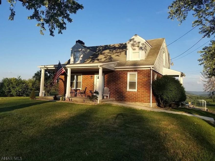 Brick cape cod with tremendous views is situated on just under 1 acre in Bedford PA. Fully renovate kitchen and bath. Second floor has a wonderful layout with outstanding use of space. Master with large walk-in closet and recently renovated bathroom. 2 car detached garage.  New gas furnace and central AC, custom stamped concrete patio.