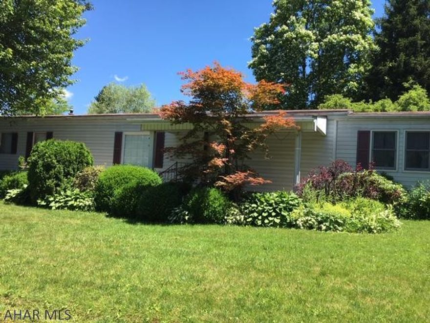 This is a single wide on a foundation with 2 additions one off of the kitchen and the sunroom off of the back side.  Large 2 car garage.  Well maintained and clean on a quiet dead end street.