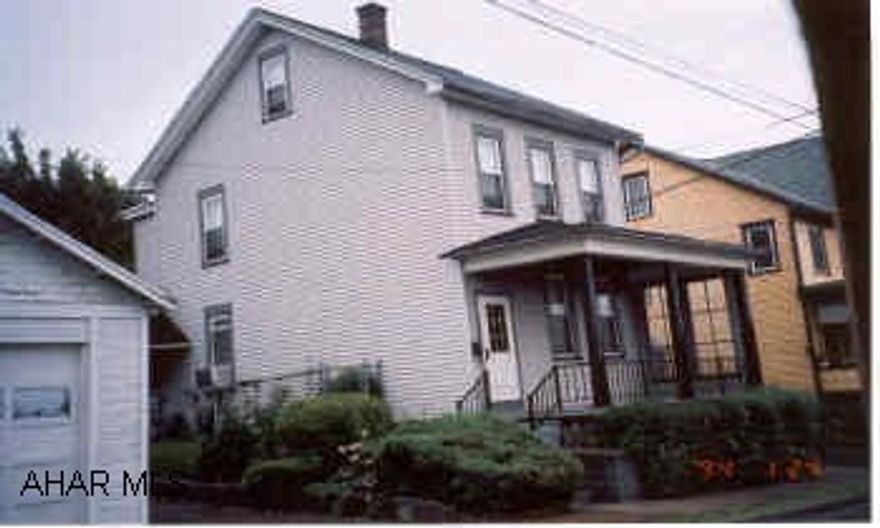 2.5 Story vinyl sided, Kit/Dining, Formal Dining Room, Formal Living Room, 4 Bedrooms, 1 bath w/attic House has new roof, replacement windows, and new siding. Fenced in yard with 4 garage stalls. covered front porch and covered patio. Call Dan Laratonda