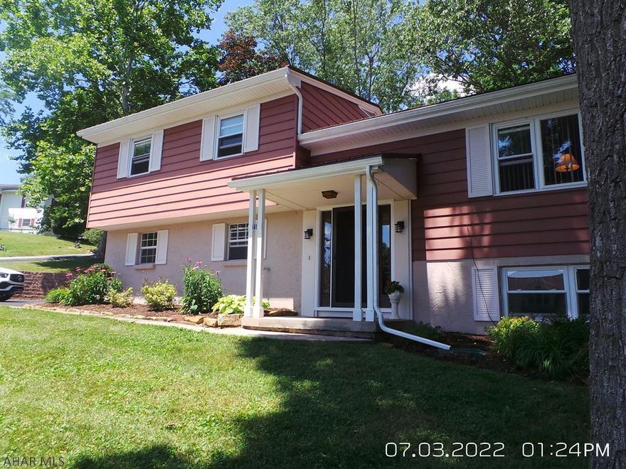 Nice multi-level home in Holiday Manor development. 3 Bedroom 2.5 Baths, Eat in Kitchen,  Lg. Family Room w/wood fireplace, covered porch off Dining Room leads to large private deck.  Metal roof, soffit, fascia, downspouts & gutters with leaf guard new in 2019, new front door w/sidelights in 2020,  2 car garage, whole house fan. Showings between 3-7PM.