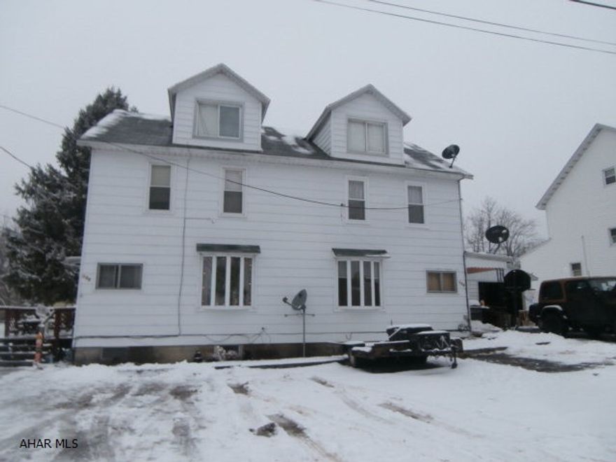 Frame duplex with 1.5 car garage. Fully rented. Separate elect and gas furnaces. Great location and opportunity for an imcome property.