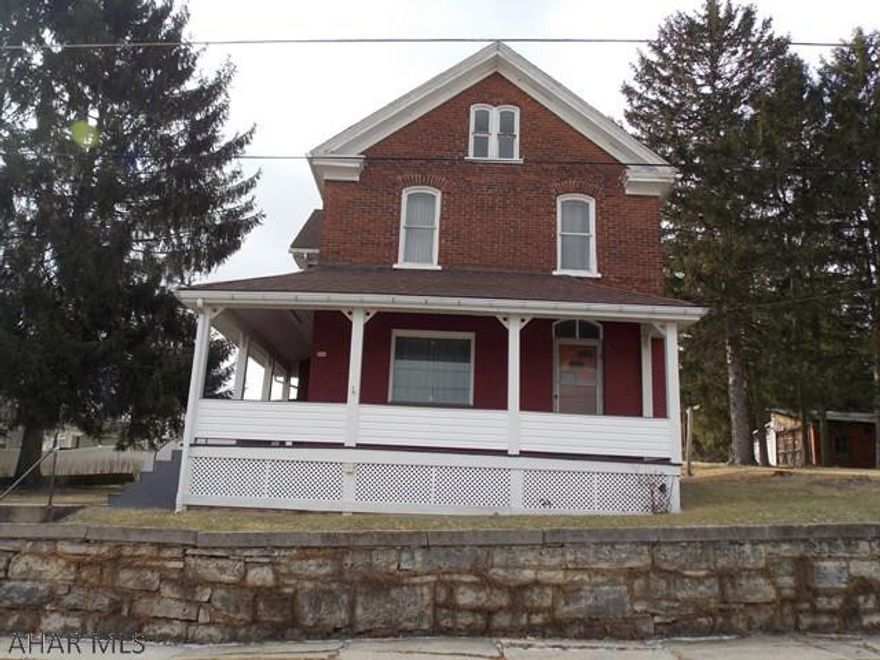 This home has been filled with love for generations!  So much potential and space for a new family in this 4BR/2BA brick home that has been freshly painted.  The 158x170 yard offers great outdoor space for the kids, dog or have a family picnic.   Behind the house there is off street parking and garage spaces for extra parking or a place for yard supplies and toys.  Your family can spend summers on the wrap around porch enjoying the view  and winters by the fireplace watching movies or football. This home is in a lovely neighborhood conveniently located by the park,  Little League field and the YMCA.  Give us a call, we would be happy to show it to you.This home could be duplexed.Seller wants an offer.