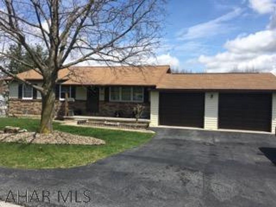 Very nice 3 Bedroom 2 Bath Ranch home on corner almost 1/2 acre lot.  Freshly painted rooms and new carpet in bedrooms.  Large 2 car garage and also 10x14 storage shed.  Basement just needs flooring, new sliding door in basement. Harmon wood/coal stove included.  New heat pump with C/A is only a few years old.