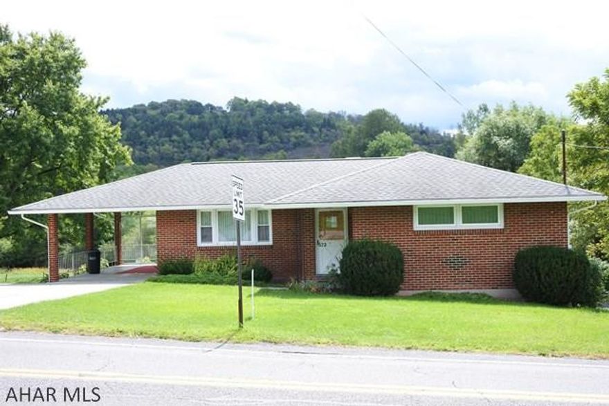 Well maintained brick ranch, new windows, updated kitchen and bath.  Hardwood floors on first level. Lower level could be finished into a very spacious family room.  Cement driveway leads to a carport or patio...additional garage (16x40) behind the house....RV Hook-up, too!!!!